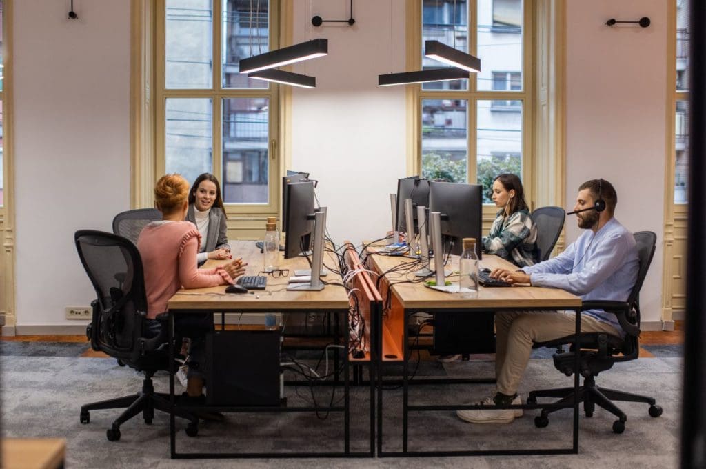 group of office workers on computers
